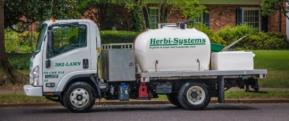 Professional lawn care company truck in Memphis, TN.